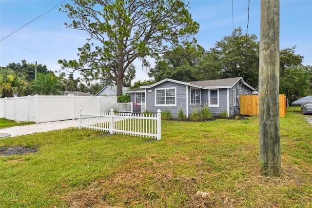 3419 19th St E, Bradenton, FL 34208 - manufactured / mobile home with gravel driveway, a front lawn, and fence private yard