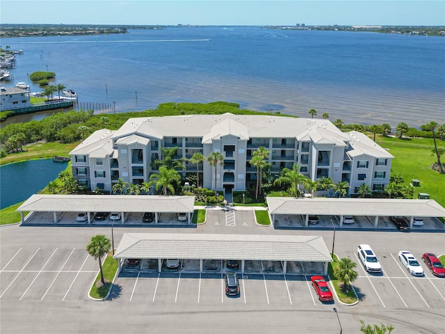 birds eye view of property with a water view