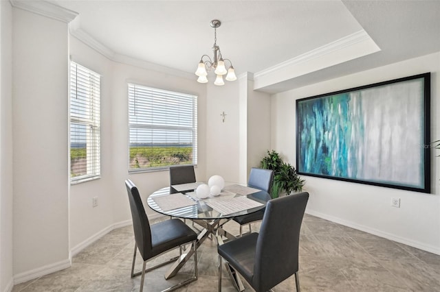 dining space featuring a wealth of natural light, a chandelier, and ornamental molding