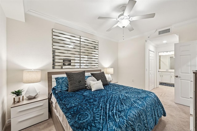 bedroom featuring ensuite bath, ceiling fan, crown molding, and light carpet