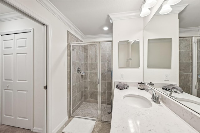 bathroom with vanity, ornamental molding, and walk in shower