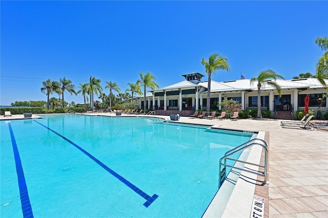 view of swimming pool featuring a patio area