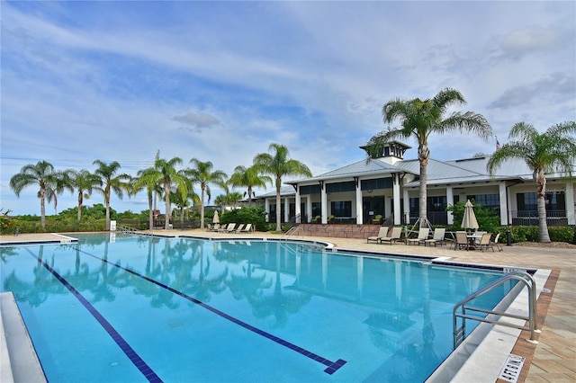 view of swimming pool with a patio area