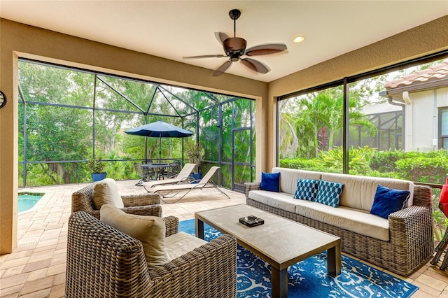 sunroom with ceiling fan