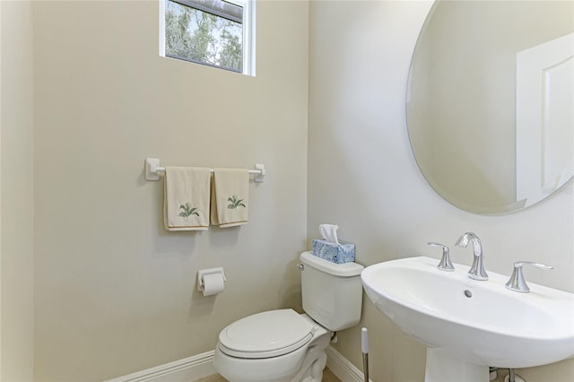 bathroom featuring sink and toilet