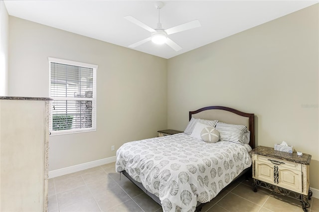 tiled bedroom with ceiling fan