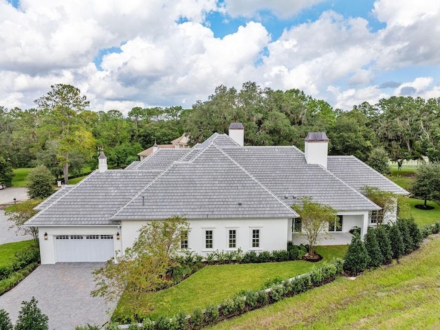 view of front facade with a front yard and a garage