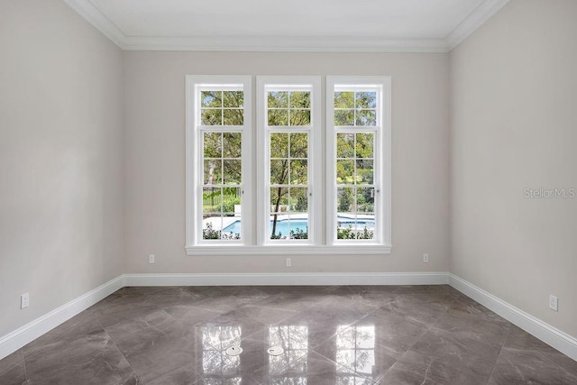 unfurnished room with a healthy amount of sunlight and crown molding