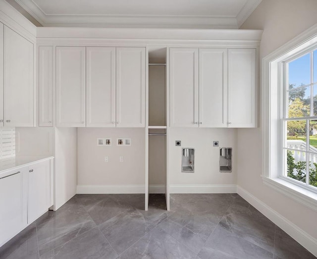 laundry room featuring hookup for an electric dryer, gas dryer hookup, cabinets, hookup for a washing machine, and crown molding