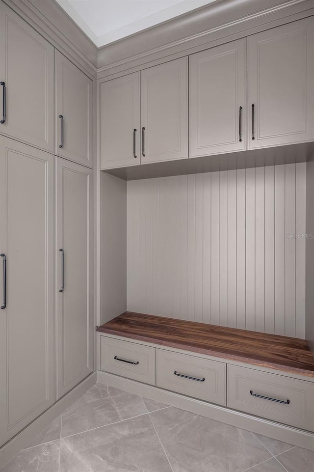 mudroom with light tile patterned floors