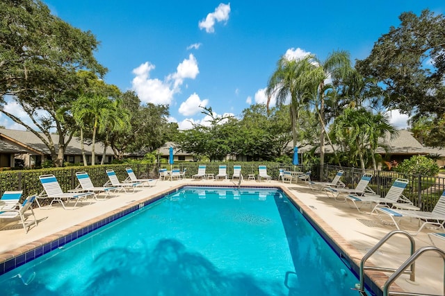 view of swimming pool with a patio area