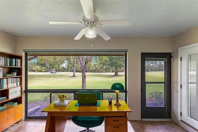 sunroom / solarium with ceiling fan