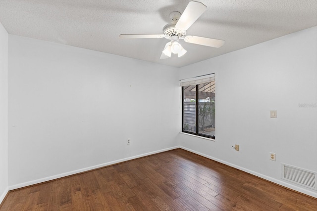 empty room featuring hardwood / wood-style floors, ceiling fan, and a textured ceiling