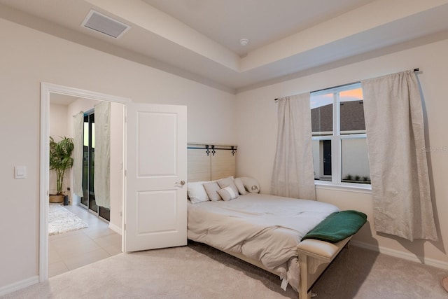 bedroom featuring light colored carpet