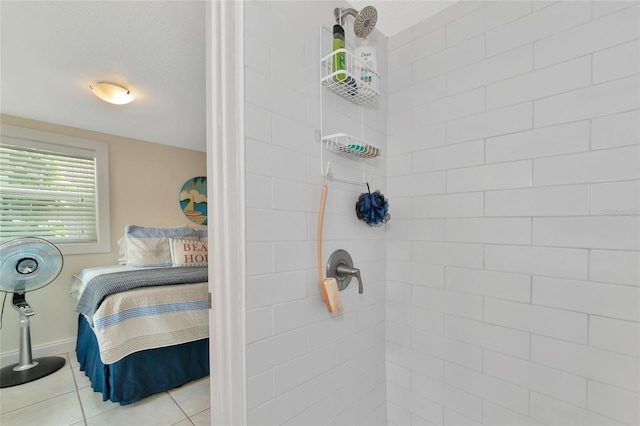 bathroom featuring a tile shower and tile patterned floors