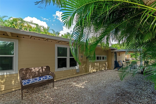 view of side of property featuring a patio area