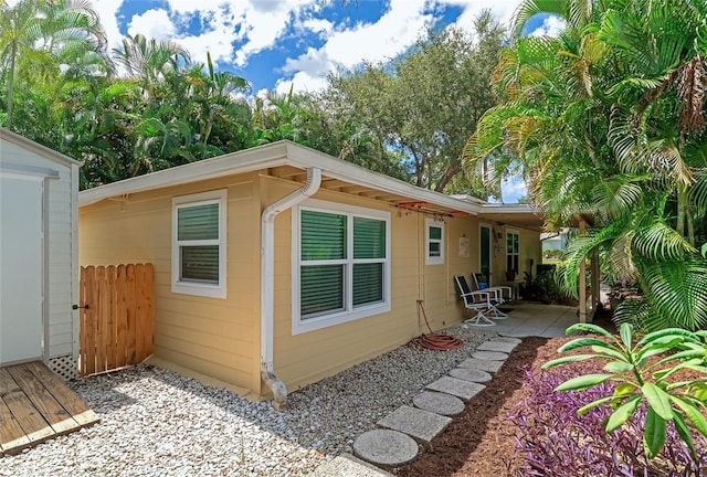 view of side of home featuring a patio area