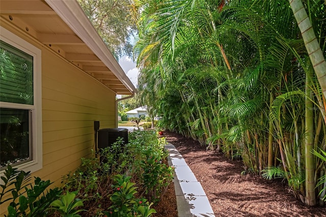 view of side of home featuring central AC unit