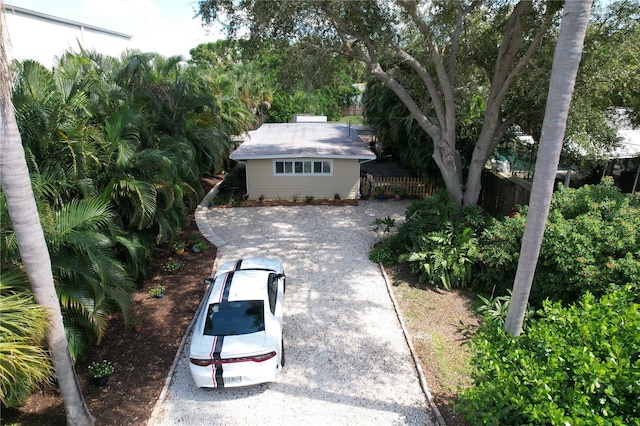 single story home with an outbuilding