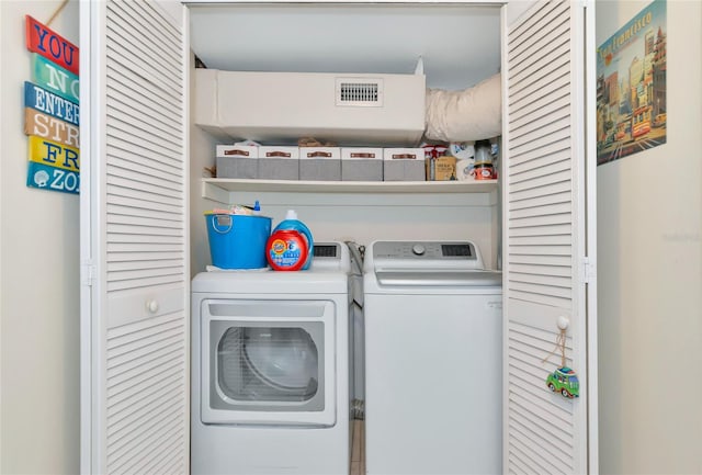 laundry room featuring independent washer and dryer