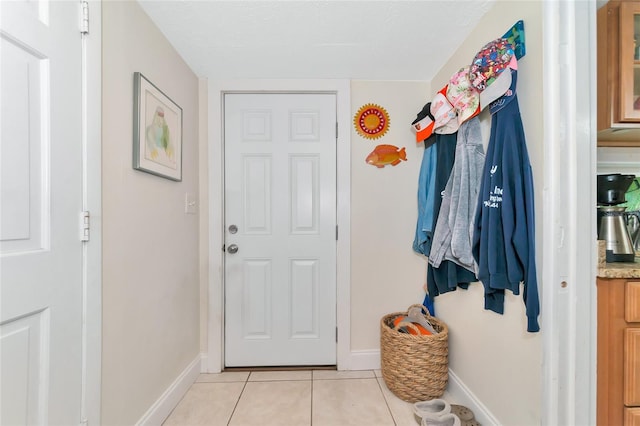 mudroom featuring light tile patterned floors