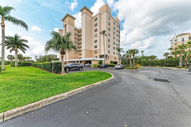 view of property with uncovered parking