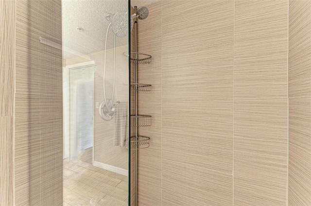 bathroom with a tile shower