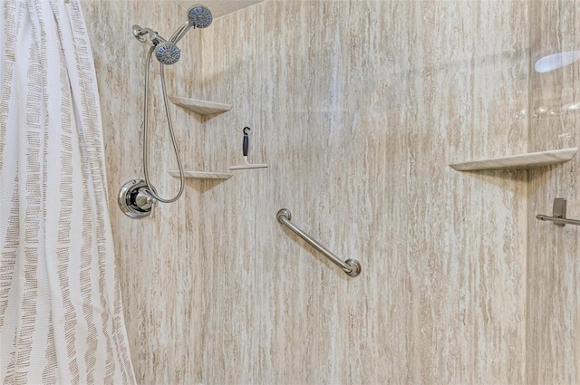 interior details featuring a shower with shower curtain