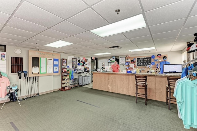 miscellaneous room featuring carpet flooring, visible vents, and a drop ceiling