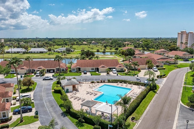 birds eye view of property with a residential view and a water view