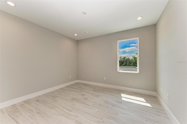 unfurnished room with light hardwood / wood-style flooring