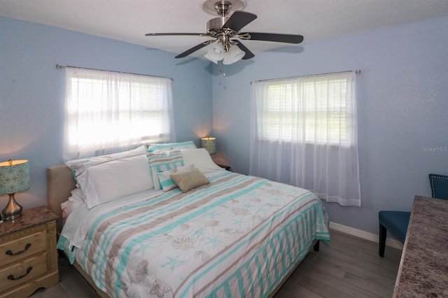 bedroom with light hardwood / wood-style floors, multiple windows, and ceiling fan