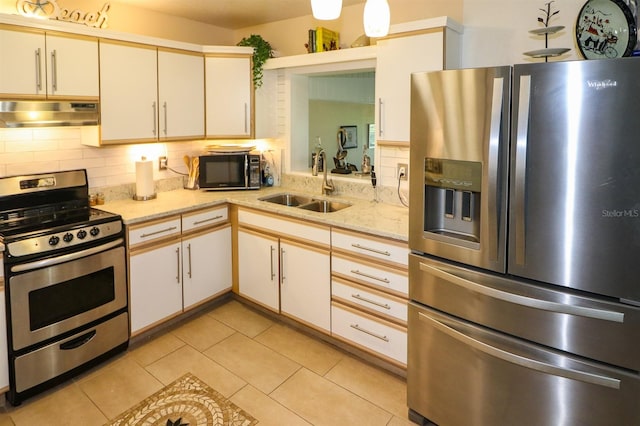 kitchen featuring light tile patterned floors, sink, tasteful backsplash, white cabinetry, and stainless steel appliances