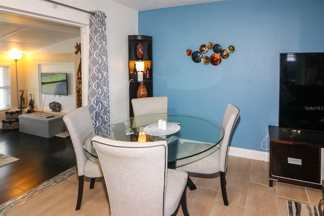 dining space featuring hardwood / wood-style flooring