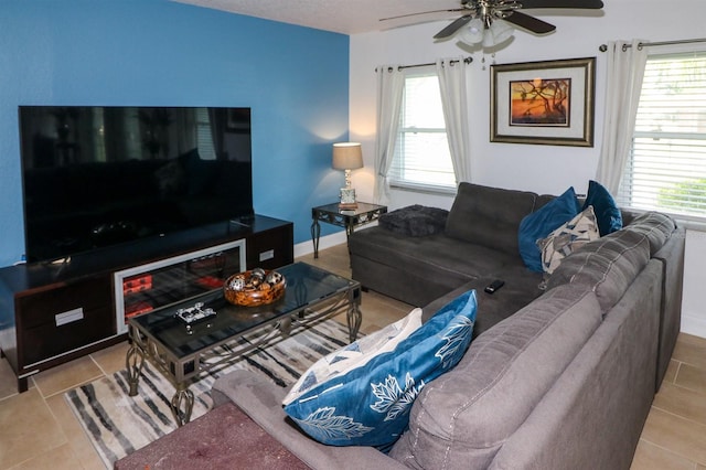 living room featuring ceiling fan and light tile patterned floors