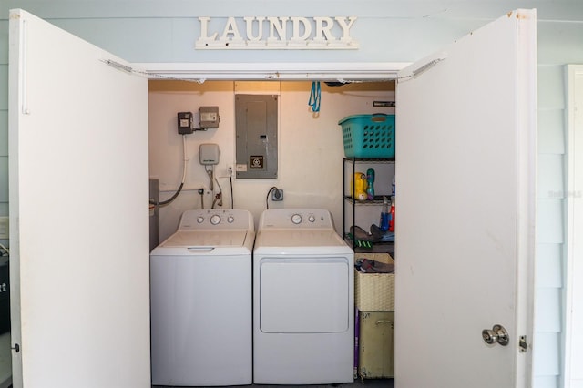 clothes washing area featuring independent washer and dryer and electric panel