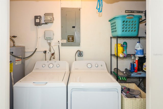 washroom with electric panel and washer and dryer