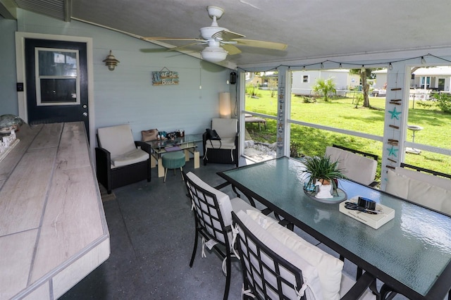 sunroom / solarium with ceiling fan