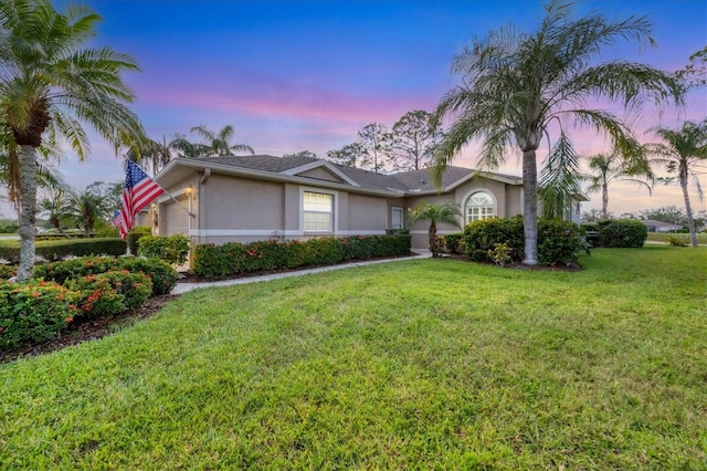 5092 Mahogany Run Ave, Sarasota, FL 34241 - single story home featuring stucco siding, a garage, and a yard
