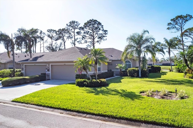 ranch-style home featuring a garage and a front yard