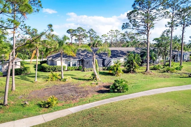 view of property's community featuring a lawn