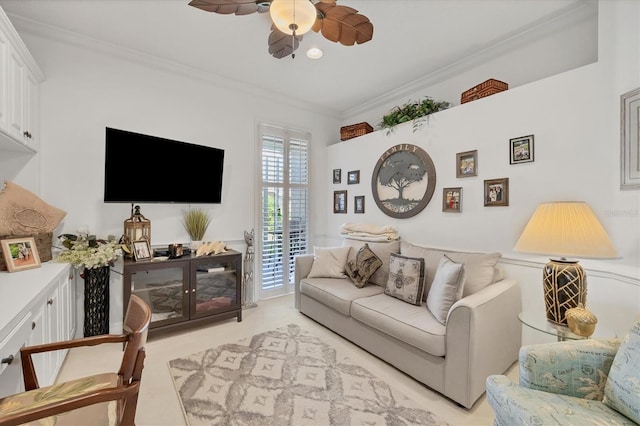 living room with ceiling fan and crown molding