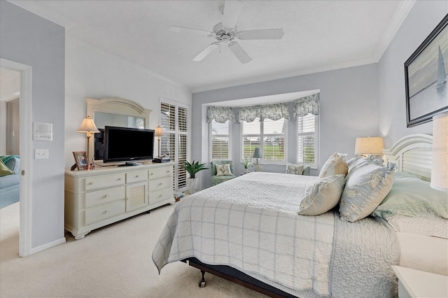 bedroom with ceiling fan, a textured ceiling, crown molding, and light colored carpet