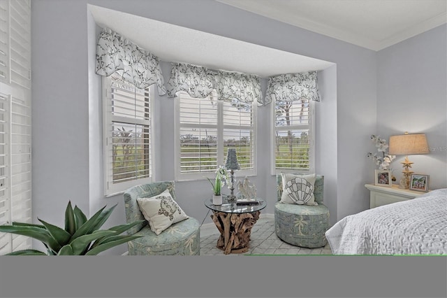 bedroom featuring multiple windows and crown molding