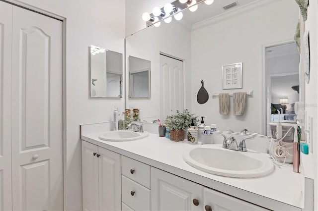 bathroom with vanity and crown molding