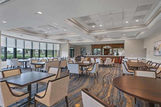 5092 Mahogany Run Ave, Sarasota, FL 34241 - carpeted dining room featuring ornamental molding, a raised ceiling, and a towering ceiling