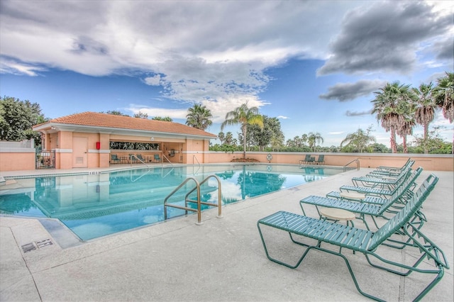 view of swimming pool featuring a patio