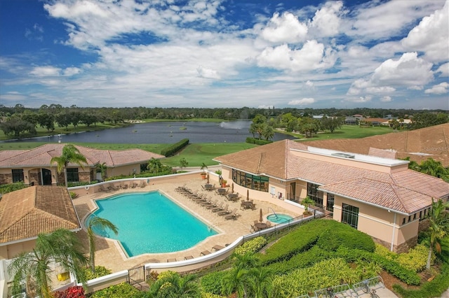 view of swimming pool featuring a water view