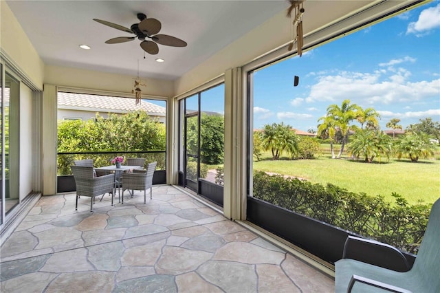 sunroom / solarium with ceiling fan