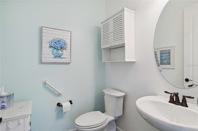 bathroom featuring sink and toilet